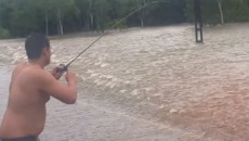 man-fishing-in-flood